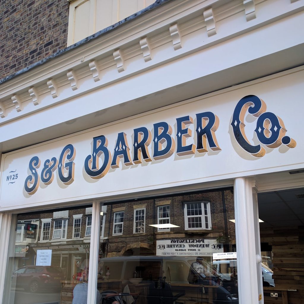 S and G barbers shop hand painted sign