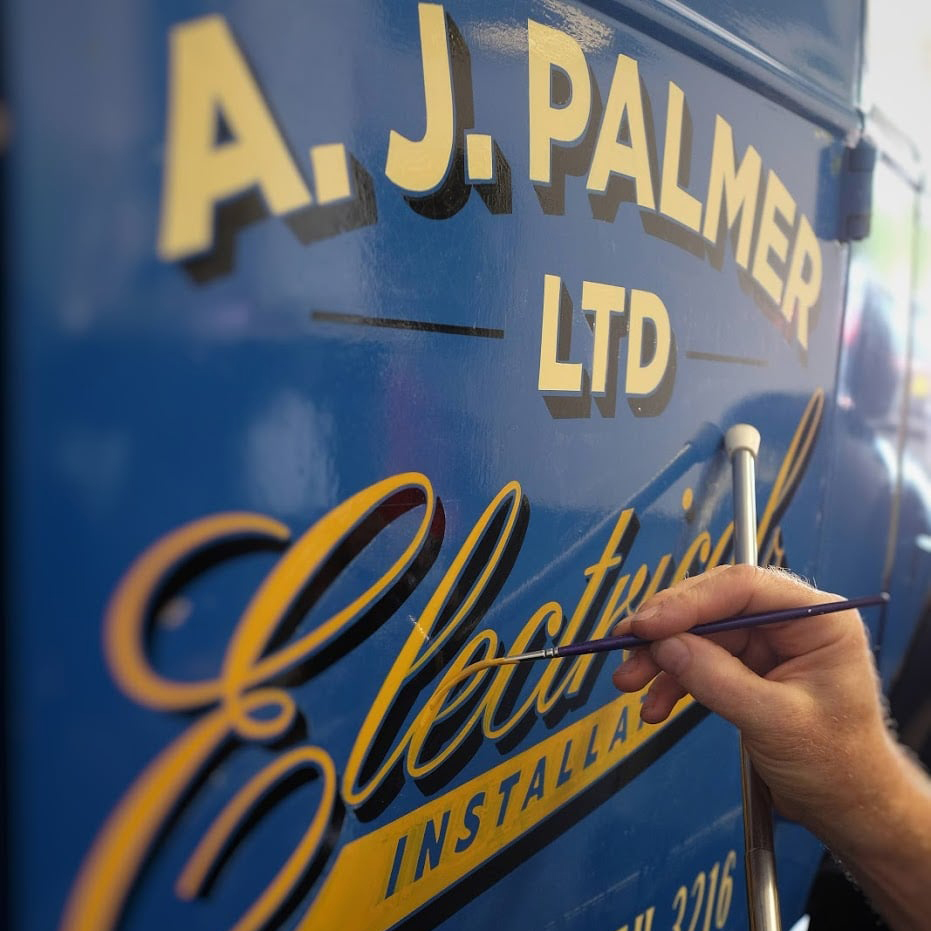 signwriting of the van in progress