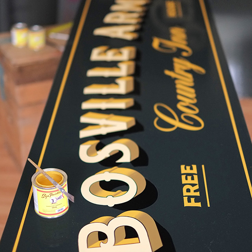 bosville arms pub signwriting with paint tin and paint brush