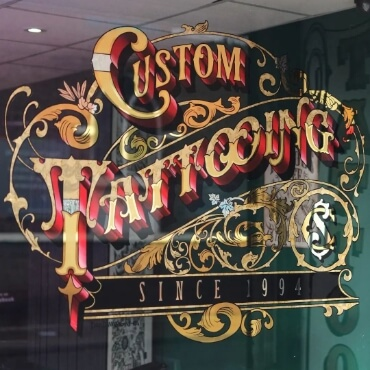 custom tattooing gold leaf sign by paul banks